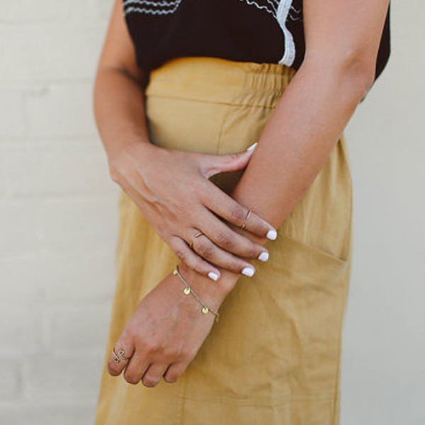 Sundance brass bracelet on girls arm